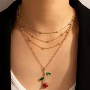 Dangly Rose Charm 4 layer gold necklace